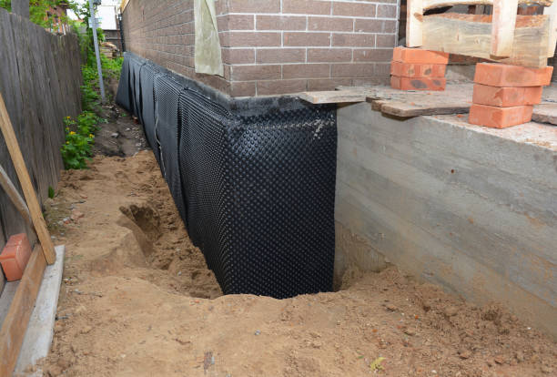 Happy homeowners after waterproofing job in Endeavor